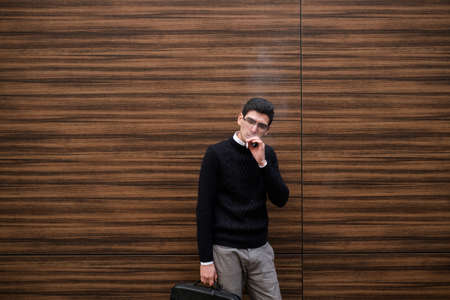 stress smoking. stressful business worker modern lifestyle. cigarette break during busy work day. copyspace conceptの写真素材