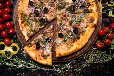 traditional italian food cuisine. delicious pizza slice bolognese with minced meat olives and tomatoesの写真素材