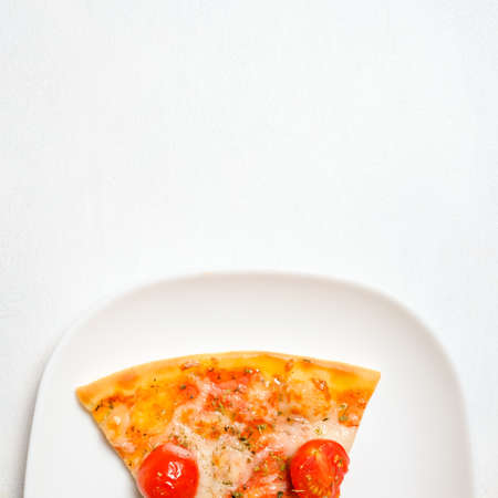 pizza slice on a plate on white background. national italian meal. food photography style. Free space conceptの写真素材