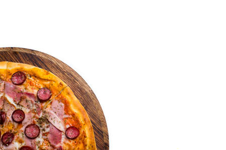 Traditional italian food. pizza with melted cheese ham and pepperoni on white background. copy space conceptの写真素材