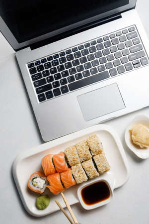 Food blogger lifestyle. Social networks and modern technology concept. Sushi deliveryの写真素材