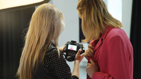 backstage fashion photography. photoshoot process. model and photographer communicationの写真素材