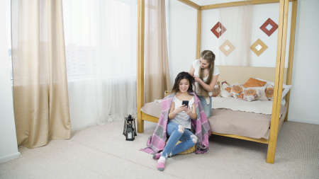 friends bff leisure pastime. hair braiding. girls beauty party.の写真素材