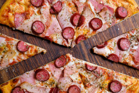 traditional meal. italian food cuisine. delicious pizza slice ham prosciutto and pepperoniの写真素材