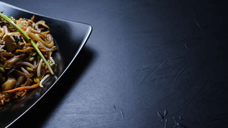 oriental cuisine food. wholesome healthy eating. vegetable salad on dark background . copyspace...