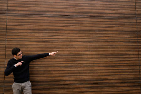 business direction. professional achievement. look there. man attracts attention by pointing hands...