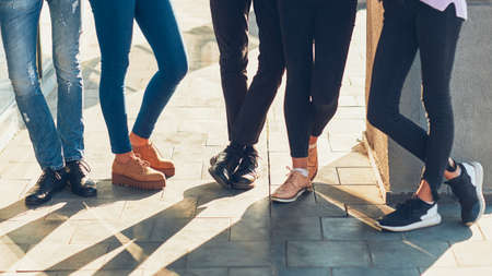 Youth lifestyle. Leisure unity communication. Group of young people in casual outfits hanging out.の写真素材