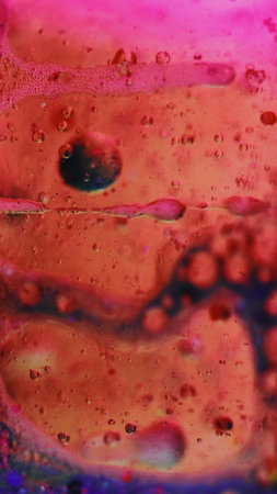 Bubble fluid oil texture paint water drop red pinkの写真素材