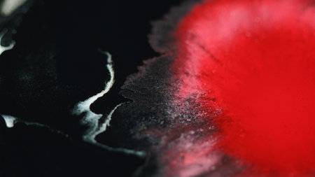 Paint drop ink water splash red black splatterの写真素材