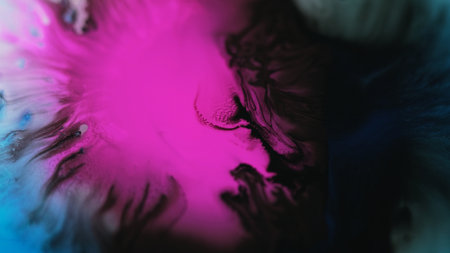 Ink drop paint splatter in water pink blue black