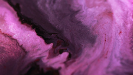 Ink wave glitter fluid paint water flow purpleの写真素材