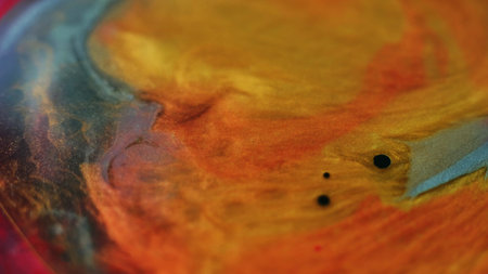 Glitter fluid splash oil blob ink water mix orange