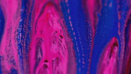 Color gel drip paint mix vivid pink blue oil blendの写真素材
