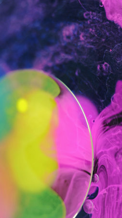 Paint water drop dye splash yellow pink oil bubbleの写真素材