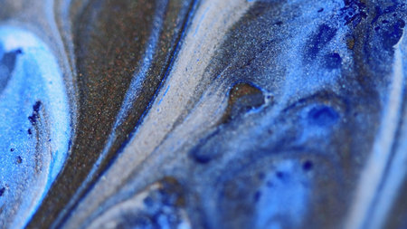Glitter fluid drip ink spill blue bronze paintの写真素材