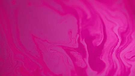 Paint background ink flow purple pink mix surfaceの写真素材