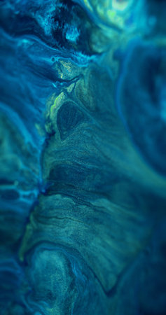 Liquid shimmer wave. Paint spill. Defocused blue color shiny glitter particles ink pigment mix acrylic emulsion fluid blend abstract art background.の写真素材