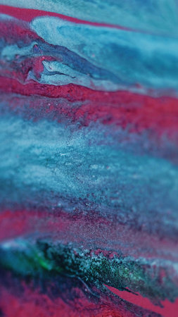 Wet glitter drip. Paint spill. Defocused pink blue green color shimmering particles texture ink leak flow abstract art background.の写真素材