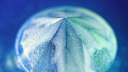 Glossy ink. Shiny gemstone. Paint flow. Defocused blue color luxury crystal brilliance radiant liquid drip shimmer light fluid abstract art background.の写真素材