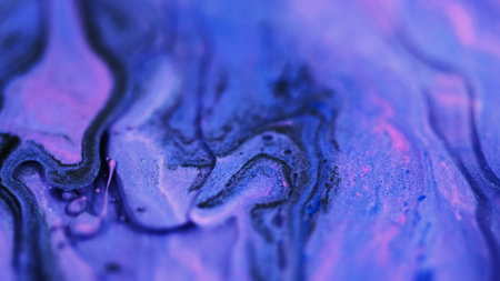 Fluid art. Sparkling ink flow. Blur purple pink black color shiny glitter grain particles acrylic paint mix emulsion liquid pigment leak abstract background.の写真素材