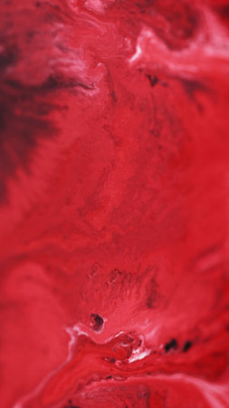 Acrylic paint mix. Color ink flow. Defocused red white black pigment dust particles dye splash emulsion fluid swirl liquid spill abstract art background.の写真素材