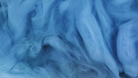 Glitter mist swirl. Paint water splash. Defocused blue color shimmering dust particles texture glowing smoke flow abstract art background.の写真素材