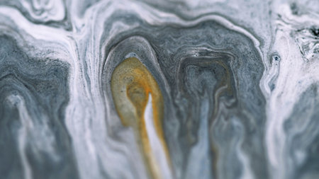 Acrylic paint spill. Marble ink texture. Defocused white gray color golden sand particles pigment powder emulsion fluid mix swirl flow abstract art background.の写真素材