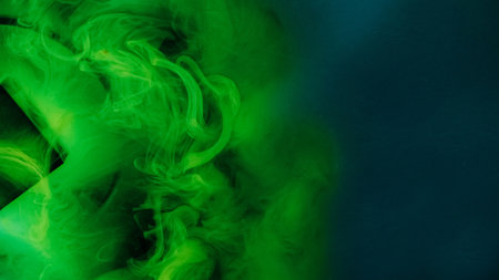 Paint water drop. Explosion cloud. Defocused vivid green blue color dust particles smoke wave flow on black abstract art background.の写真素材