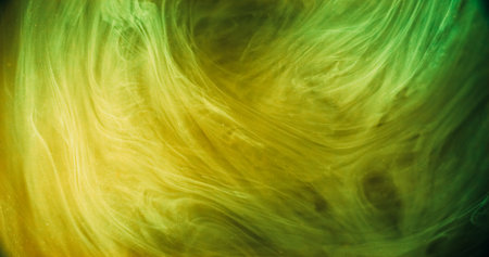 Mist texture. Glitter paint splash. Blur neon green yellow glowing vapor cloud silk wave acrylic ink on black abstract art background.の写真素材