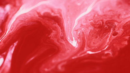 Color blend. Paint water flow. Defocused red pink white floating pigment dust particles acrylic dye ink fluid spill liquid mix abstract art background.の写真素材