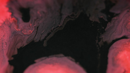 Paint splash. Ink blend. Defocused black red color shimmering glitter particles texture acrylic fluid water mix abstract art background.の写真素材
