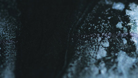 Sparkle fluid spill. Glitter ink mix. Blur black silver color metallic shimmering sand particles texture liquid pigment acrylic paint flow abstract art background.の写真素材