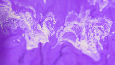 Sparkling paint drip. Ink spill. Defocused purple white color shimmering glitter particles acrylic liquid mix dye swirl emulsion fluid wave abstract art background.の写真素材