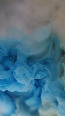 Explosion cloud. Ink water drop. Defocused blue color glitter texture ethereal smoke wave flow abstract art background.の写真素材