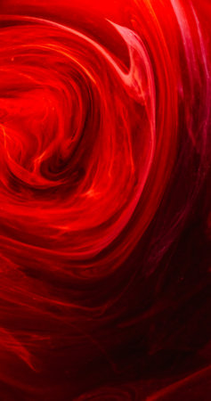 Vapor swirl. Mist vortex. Defocused red color flame sparks dust wave texture ink floating mix whirl rotation on dark black abstract art background.の写真素材
