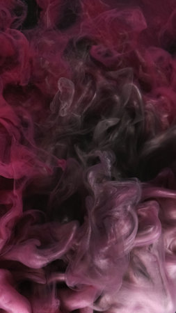 Sparkling paint water. Vapor cloud. Defocused pink color shimmering particles texture smoke floating on dark black abstract art background.の写真素材
