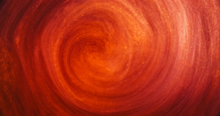 Glitter mist. Ink swirl. Defocused red orange golden color vapor cloud shiny particles texture paint floating in water abstract art background.の写真素材