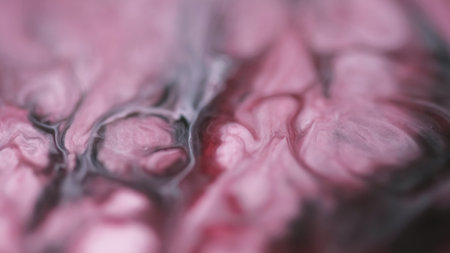Blur wave. Ink blend. Defocused pink white color marble particles texture liquid emulsion stream flow abstract art background.の写真素材