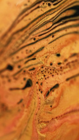 Shiny paint leak. Glitter wave. Defocused black golden color shimmering particles texture oil liquid...