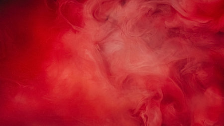 Ink water drop. Smoke cloud. Defocused red pink color shimmering glitter floating underwater explosion blob dreamlike abstract art background.の写真素材