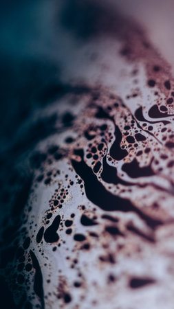 Acid ink. Bubble liquid. Defocused blue color fizzy texture chemical fluid wave on dark black abstract art background.の写真素材