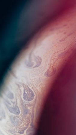 Fluid spill. Blur ink mix. Defocused blue yellow color acrylic liquid emulsion blend stain wave on dark abstract art background.の写真素材