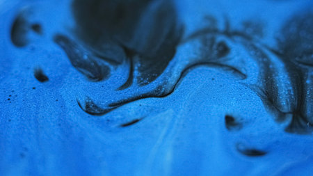 Sparkling paint mix. Glitter spill. Blur black blue color shimmering particles texture acrylic stream wave abstract art background.の写真素材
