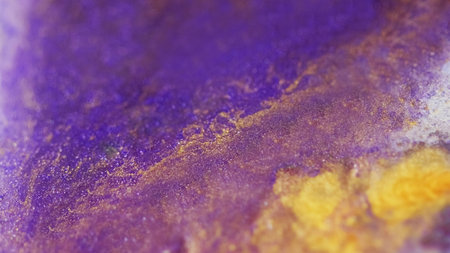 Wet glitter spill. Bokeh light. Defocused purple golden yellow color sparkling particles texture...