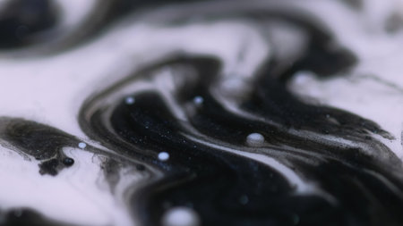 Blur ink drop. Glitter blot. Defocused black white sparkling droplets floating acrylic texture oil fluid splash abstract art background.の写真素材