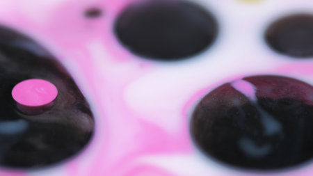 Ink bubbles. Fizzy liquid. Defocused black pink white color round droplets floating acrylic texture fluid mix abstract art background.の写真素材