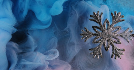 Glitter snowflake. Christmas ornament. Shimmering silver winter decoration on blue pink color ink...