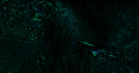 Fantastic surface. Wet highlights. Fabric texture with iridescent light. Rough silver background...