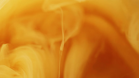 Cloud swirl. Paint splash. Defocused bright yellow orange ink mist vortex vapor steam moving on...