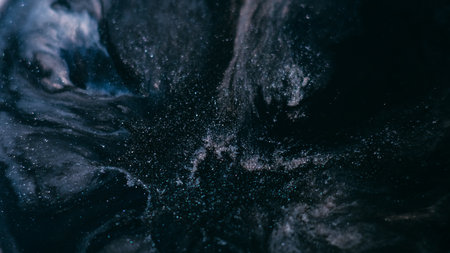 Glitter blob. Grunge explosion. Liquid art shimmering gray black blue emulsion spills enamel surface marble abstract background opener.の写真素材